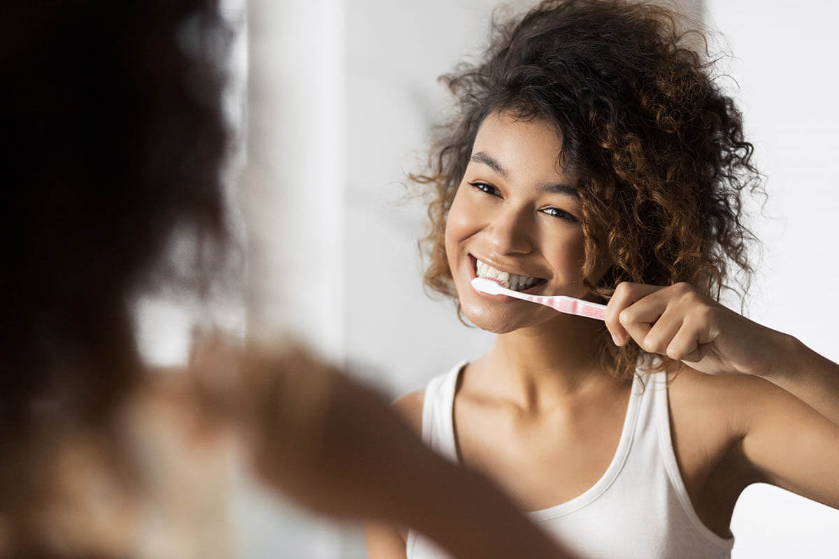 oral care girl showing how to care for teeth after Halloween