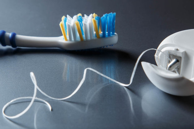 The difference between flossing and brushing An example of a toothbrush and floss