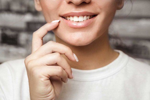 cosmetic-dentistry,-smiling (1) woman wonders if at home whitening will work for her