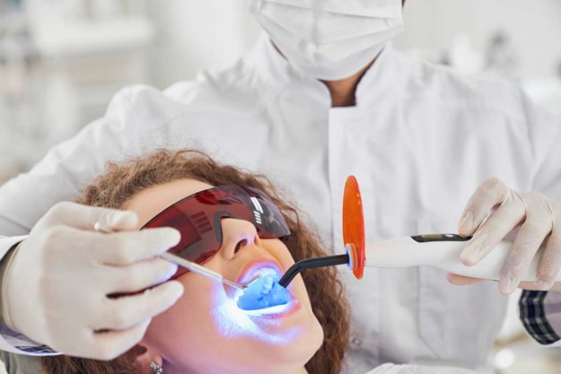 laser-dentistry (1) woman getting laser dental treatment