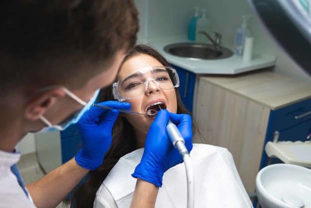 When is a Root Canal Necessary woman gets a root canal