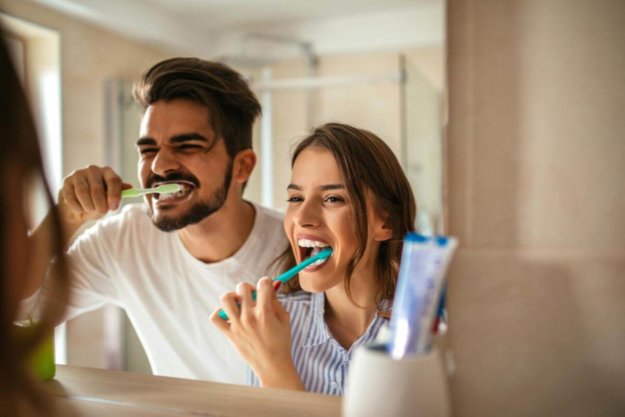 5 Easy Ways to Prevent Cavities man and woman prevent cavities