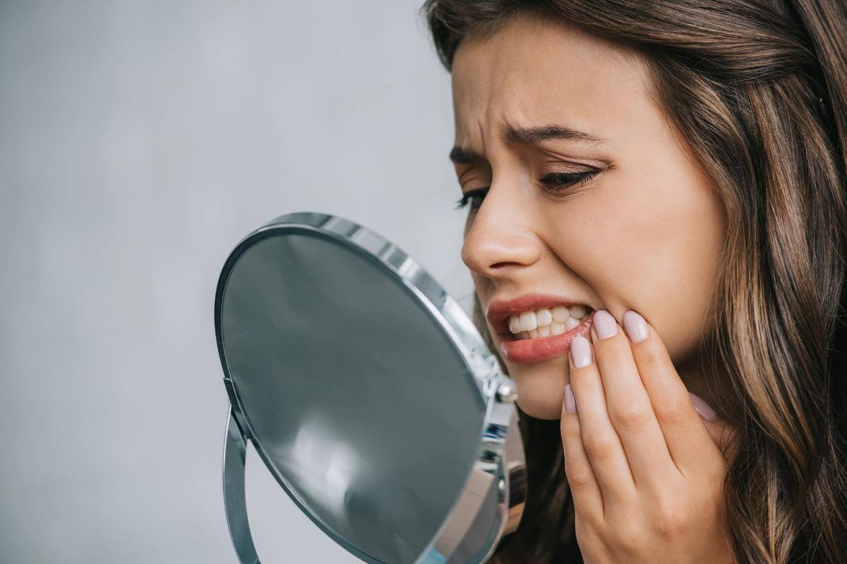 Dangers of DIY Teeth Whitening woman experiences the dangers of DIY teeth whitening