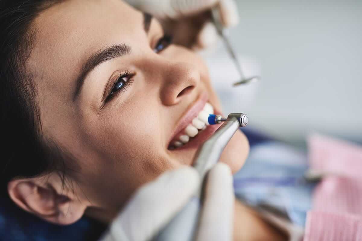 woman undergoing a necessary teeth cleaning