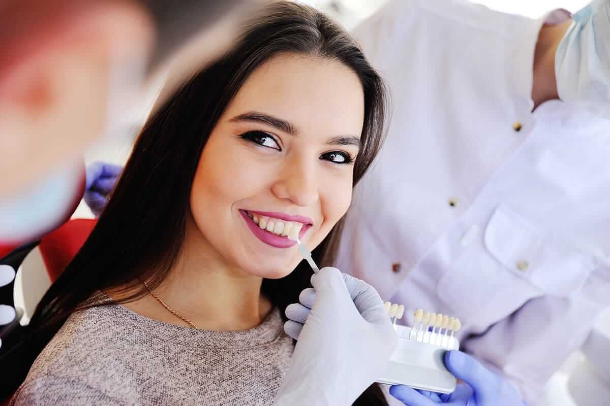 patient with endodontist learning about how long veneers