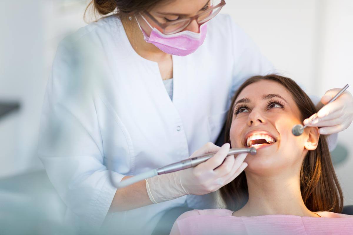 a woman getting work done on her teeth after finding a cosmetic dentist in columbia md