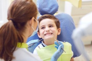 a child smiling at his dentist in pediatric dentistry columbia md