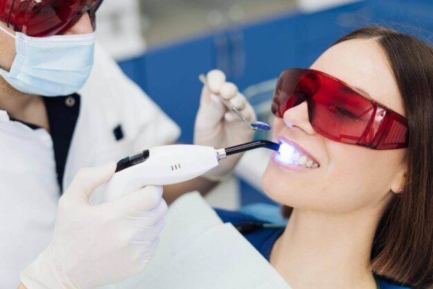 woman receives laser dental treatment near columbia md