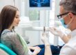 A woman wondering about dental implant cost