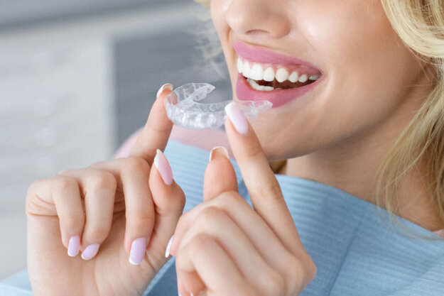 A woman considering Invisalign vs. braces