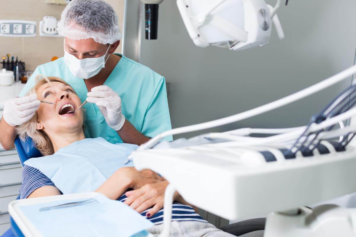 Dental Bridge vs. Crown A patient learning about how to get rid of cavities