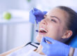 A woman wondering, "How much does dental bonding cost?"