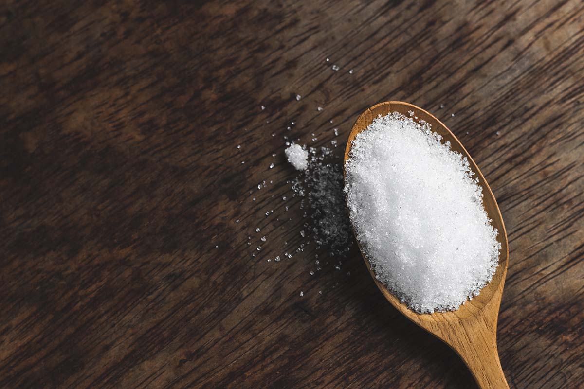 A spoon full of sugar, symbolizing the question: How much sugar is too much?