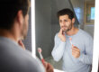 A man experiencing the signs of gum disease