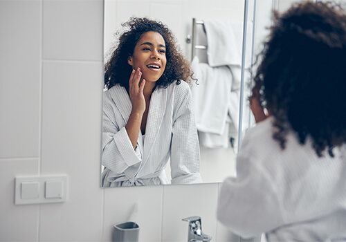 A woman going through root canal recovery