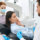 A dentist explains the signs of a dental injury to a patient