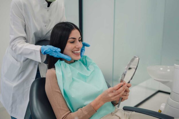 Daily Habits For A Healthy Smile A patient practicing habits for a healthy smile