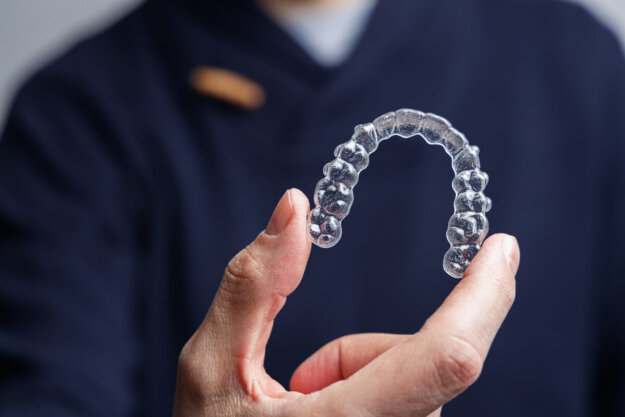 Man holding Invisalign