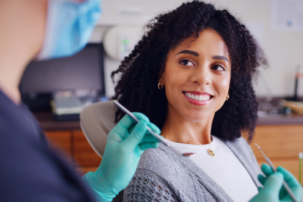 What Is a Root Canal A Complete Guide to the Procedure and Recovery Columbia Smiles Image 1 Woman in dentists chair about to get a root canal